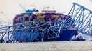 BALTIMORE, MARYLAND - MARCH 27: Cargo ship Dali sits in the water after running into and collapsing Baltimore&apos;s Francis Scott Key Bridge on March 27, 2024 in Baltimore, Maryland. Two survivors were pulled from the Patapsco River and six missing people are presumed dead after the Coast Guard called off search and rescue efforts. A work crew was fixing potholes on the bridge, which is used by roughly 30,000 people each day, when the ship struck at around 1:30am on Tuesday morning. The accident has temporarily closed the Port of Baltimore, one of the largest and busiest on the East Coast of the U.S. (Photo by Tasos Katopodis/Getty Images)