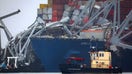 A U.S. Army Corps of Engineers boat passes the wreckage of the Dali cargo ship on Wednesday, March 27. 