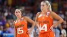 GREENVILLE, SOUTH CAROLINA - MARCH 26: Hanna Cavinder #15 and Haley Cavinder #14 of the Miami Hurricanes react during the fourth quarter of the game against the LSU Lady Tigers in the Elite Eight round of the NCAA Women&apos;s Basketball Tournament at Bon Secours Wellness Arena on March 26, 2023 in Greenville, South Carolina. 