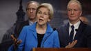 WASHINGTON, DC - FEBRUARY 09: Sen. Elizabeth Warren (D-MA) (C) talks to reporters with Sen. Jeff Merkley (D-OR) (L), Sen. Chris Van Hollen (D-MD) and fellow Senate Democrats during a news conference at the U.S. Capitol to celebrate a new policy that demands recipients of foreign military aid adhere to international humanitarian law at the U.S. Capitol on February 09, 2024 in Washington, DC. 