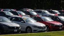 Vehicles for sale on a Volkswagen dealership lot in St. James, New York on Sept. 21, 2022.