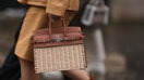 PARIS, FRANCE - MARCH 02: Fashion Week Guest seen wearing a brown leather coat, brown boots and Hermes Birkin picnic bag outside Hermes show, during the Womenswear Fall/Winter 2024/2025 as part of Paris Fashion Week on March 02, 2024 in Paris, France. (Photo by Jeremy Moeller/Getty Images)
