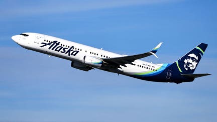 An Alaska Airlines plane takes off from Los Angeles International Airport on Dec. 4, 2023, in Los Angeles, California.