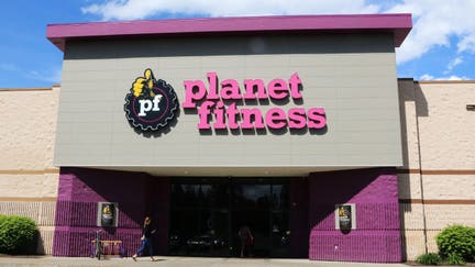 Planet Fitness health center entrance showing company logo above doors. (Photo by: Don and Melinda Crawford/UCG/Universal Images Group via Getty Images)