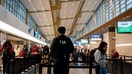 A Transportation Security Administration (TSA) officer at Ronald Reagan National Airport (DCA) in Arlington, Virginia, U.S., on Tuesday, Nov. 21, 2023. 