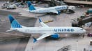 A United Airlines Boeing 737 Max 9 airplane parked at a gate at Newark Liberty International Airport (EWR) in Newark, New Jersey, US, on Tuesday, March 19, 2024. United Airlines Holdings Inc.s shares rose after the carrier forecast better-than-expected profit this quarter, tempering concerns that Boeing Co. aircraft delays and regulatory pressure will put expansion plans at risk. 