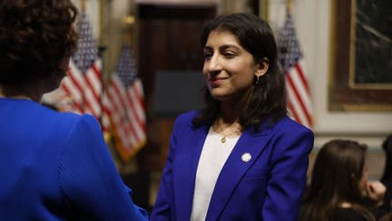 WASHINGTON, DC - APRIL 03: Federal Trade Commission Chair Lina Khan (C) talks with guests during an event about the Biden administrations work to lower the cost of breathing treatments for asthma and COPD patients in the Indian Treaty Room in the Eisenhower Executive Office Building on April 03, 2024 in Washington, DC. "Finally, we beat big pharma," Biden said and credited Khan with helping lower the cost of asthma inhalers from three of the four top companies to just $35 per month starting in June. 