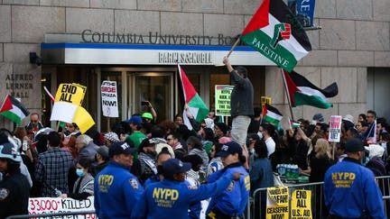 Pro-Palestinian activists protest outside Columbia University in New York City on April 20, 2024. (Photo by Leonardo Munoz / AFP) (Photo by LEONARDO MUNOZ/AFP via Getty Images)