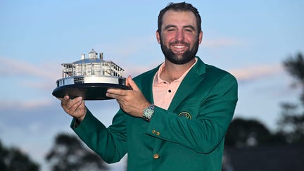 Scottie Scheffler poses with the winner's trophy as the 2024 Masters Champion after the final round of  Masters Tournament at Augusta National Golf Club on April 14, 2024 in Augusta, Georgia.