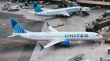 A United Airlines Boeing 737 Max 9 airplane parked at a gate at Newark Liberty International Airport (EWR) in Newark, New Jersey, US, on Tuesday, March 19, 2024. United Airlines Holdings Inc.s shares rose after the carrier forecast better-than-expected profit this quarter, tempering concerns that Boeing Co. aircraft delays and regulatory pressure will put expansion plans at risk. 