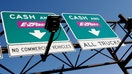 Cash and E-Z Pass signs at the New Jersey Turnpike. (Photo by: Jeffrey Greenberg/Universal Images Group via Getty Images)
