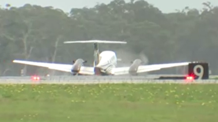 The plane is seen grinding along the tarmac at Newcastle Airport after touching down.