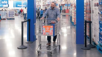 Sam's Club customer leaving store through new artificial intelligence-powered exit checkpoint.
