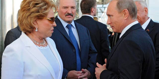 Russian President Vladimir Putin, right, Belarusian President Alexander Lukashenko, second south, and Upper House Speaker Valentina Matviyenko, left, visit Sirius University for children’s gifts at the Black Sea Hotel in Sochi, Russia, Friday, Sept. 18, 2015.