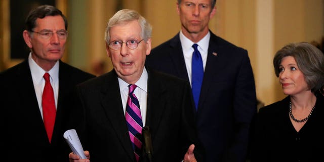 Senate Majority Leader Mitch McConnell, R-Ky., with, from left, Sens. John Barrasso, R-Wyo., McConnell, John Thune, R-S.D., and Joni Ernst, R-Iowa, speakING to reporters on Capitol Hill in Washington, Tuesday. (AP Photo/Manuel Balce Ceneta)