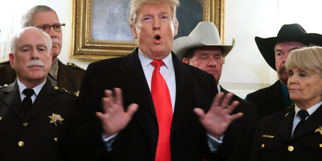 President Donald Trump speaks during a meeting with a group of sheriffs from around the country before leaving the White House in Washington, Monday, Feb. 11, 2019, for a trip to El Paso, Texas. (AP Photo/Manuel Balce Ceneta)