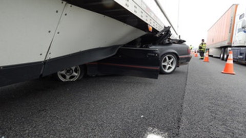 Indiana Ford Mustang driver survives getting stuck under tractor trailer