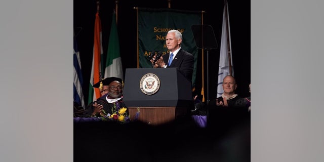 Vice President Mike Pence delivers the commencement address at Taylor University in Upland, Ind., on Saturday.