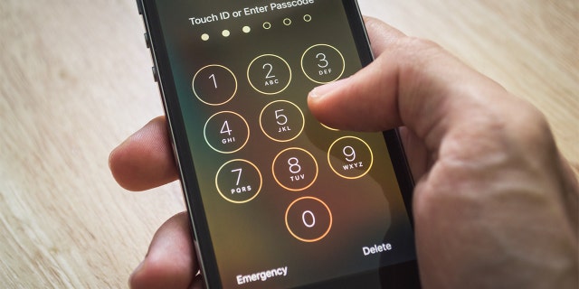 Bangkok, Thailand - December 12, 2015 : Apple iPhone5s held in one hand showing its screen for entering the passcode. Researchers from Kyushu University's Institute for Materials Chemistry and Engineering who worked with the University of Tokyo developed an olfactory (smell) sensor that can identify a person by analyzing their breath, the report said.