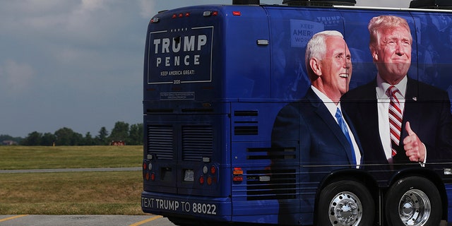 A campaign bus waits in a lot before Vice President Mike Pence arrives at Lancaster Airport in Lititz, Pa., for a series of stops in Pennsylvania on July 9, 2020. (Tim Tai/The Philadelphia Inquirer via AP, Pool)
