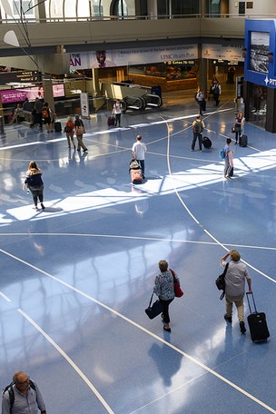 Woman throws water at TSA, makes a run for it