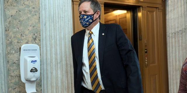 Sen. Steve Daines, R-Mont., arrives for votes during a rare weekend session to advance the confirmation of Judge Amy Coney Barrett to the Supreme Court, at the Capitol in Washington. (AP Photo/J. Scott Applewhite)