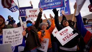 Nevada poll worker claims that a group of people 'formed a human wall' to block visibility as they tampered with ballots