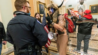 Man in bearskin headress in Capitol was booted from Navy over refusal of vaccine, report says