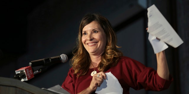 Lt. Gov. Janice McGeachin tears up a FEMA COVID agreement as she announces her run for Idaho governor at the Downtown Event Center in Idaho Falls, Idaho, on Wednesday, May 19, 2021. (Associated Press)