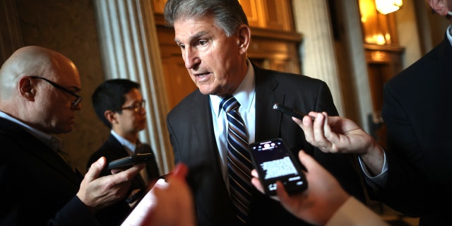 WASHINGTON, DC - MAY 28: Sen. Joe Manchin (D-WV) talks with reporters after stepping off the Senate Floor at the U.S. Capitol on May 28, 2021 in Washington, DC. The Senate decided to postpone debate on the act after a small group of Republicans filibustered the bill overnight. The Senate also failed to reach the 60 votes necessary to end debate on the legislation that would approve the formation of a 9/11-style commission to investigate the attack lead by Trump supporters on the Capitol to attempt to halt the certification of the 2020 presidential election. (Photo by Chip Somodevilla/Getty Images)