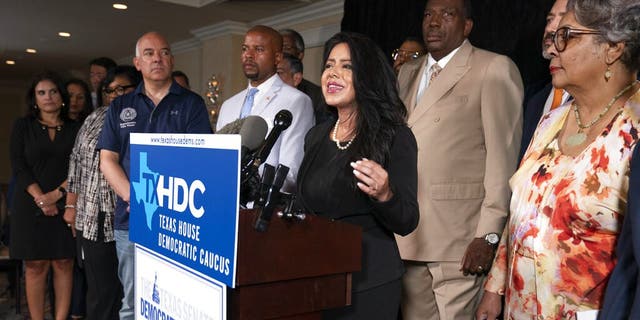 Democratic Texas State Rep. Victoria Neave from Dallas, center, together with fellow Texas legislators, speaks during a news conference, Wednesday, July 14, 2021, in Washington. (AP Photo/Manuel Balce Ceneta)
