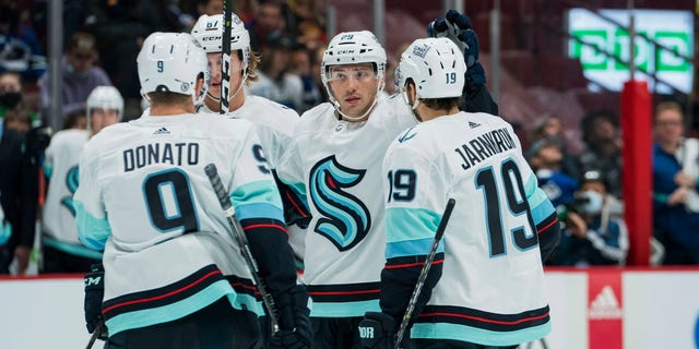 NHL 2021-22 Pacific Division preview: Seattle Kraken to choose identity in inaugural season 2 Oct 5, 2021; Vancouver, British Columbia, CAN; Seattle Kraken defenseman Vince Dunn (29) celebrates with forward Ryan Donato (9) and forward Morgan Geekie (67) and forward Calle Jarnkrok (19) after scoring a goal against the Vancouver Canucks in the second period at Rogers Arena. Mandatory Credit: Bob Frid-USA TODAY Sports