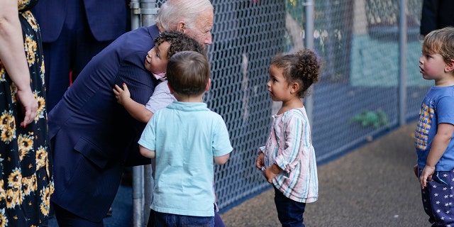 President Joe Biden greets children as he visits the Capitol Child Development Center, Friday, Oct. 15, 2021, in Hartford, Conn.
