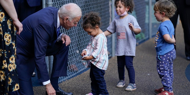 President Joe Biden greets children as he visits the Capitol Child Development Center, Friday, Oct. 15, 2021, in Hartford, Conn.