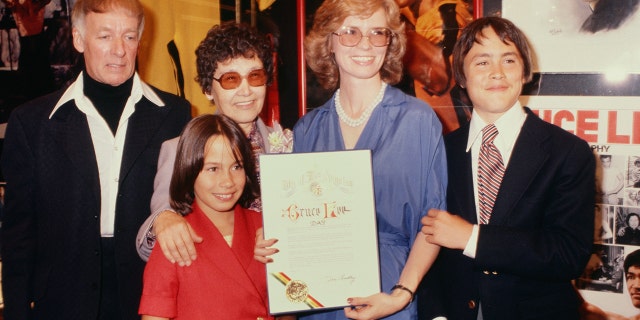 Bruce Lee's mother, wife Linda, children Brandon and Shannon celebrate Bruce Lee Day circa 1979 in Los Angeles California. Brandon died at the age of 28 on set of ‘The Crow’ in 1993 after he was fatally shot with an improperly loaded prop gun.
