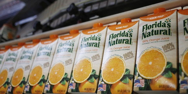 Freshly-filled cartons of orange juice move down a production line at Florida's Natural Growers plant in Lake Wales, Florida, U.S., on Thursday, May 26, 2016. Luke Sharrett/Bloomberg via Getty Images