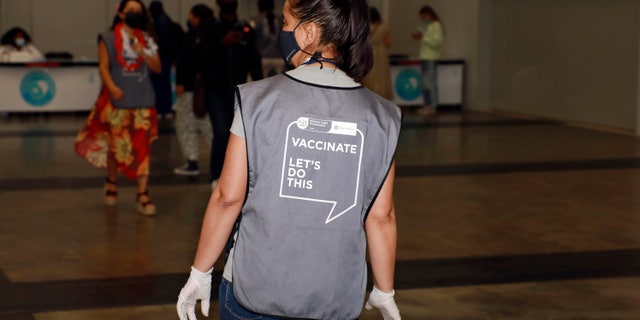A staff member is seen at the Vaccination Centre of Hope at the Cape Town International Convention Centre in Cape Town, South Africa, Friday, Dec. 3, 2021. The mass Covid-19 vaccination site is closing today after vaccinating more than 136 000 people at the Western Cape's first mass vaccination centre. (AP Photo/Nardus Engelbrecht)
