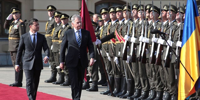 FILE – Sept. 19, 2019: President of Ukraine Volodymyr Zelenskyy and President of the Republic of Finland Sauli Niinistö (L to R) walk down the red carpet.