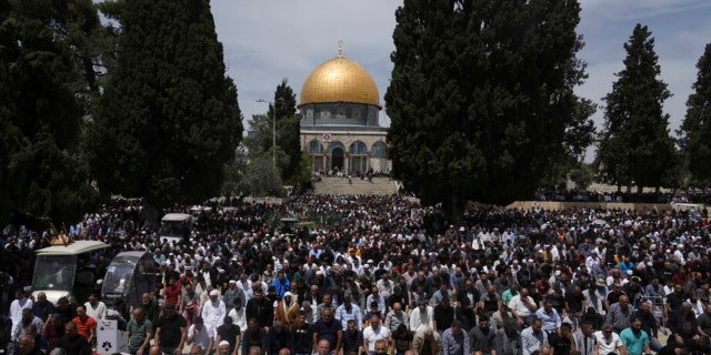 Palestinians gather for Friday prayers during the Muslim holy month of Ramadan, hours after Israeli police clashed with protesters at the Al Aqsa Mosque compound in Jerusalem's Old City Friday, April 22, 2022.