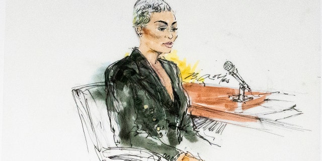 In this courtroom artist sketch, former reality television star Blac Chyna sits in court in Los Angeles, Tuesday, April 19, 2022. A jury has been seated in the trial that pits model and former reality television star Blac Chyna against the Kardashian family, who she alleges destroyed her TV career.