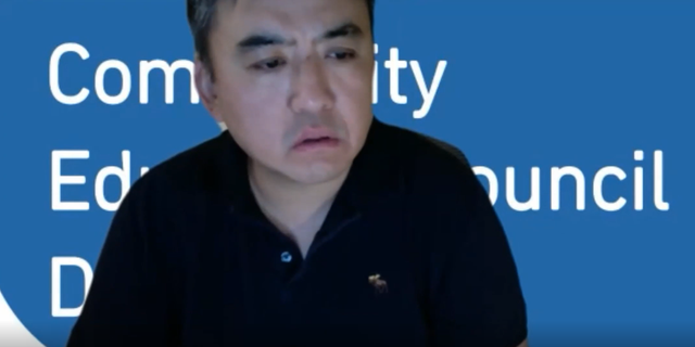 A public school parent, Chien Kwok, returned to the DOE staff answering a question about the New York City school.