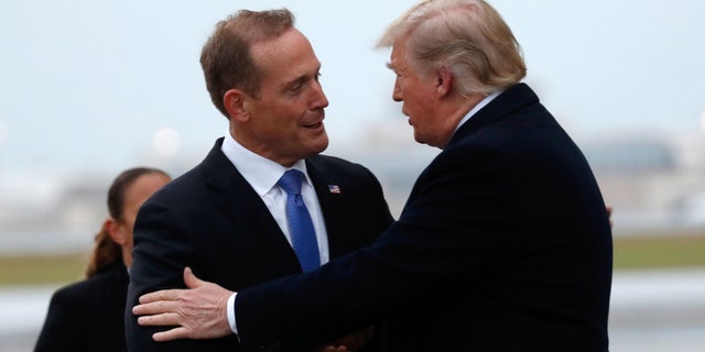 U.S. President Donald Trump greets Ted Budd, Republican candidate from North Carolina's 13th district, in Charlotte, North Carolina, U.S., October 26, 2018. REUTERS/Kevin Lamarque