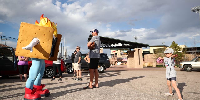 Baseball team shuts out pro-life organizations, cancels family night hours before first pitch - messi transfer news today 2021 - Sports - Public News Time Rocky Mountain Vibes mascot Toasty in parking lot with fans.