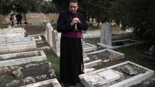 Dozens of Christian graves toppled, defaced in historic Jerusalem cemetery