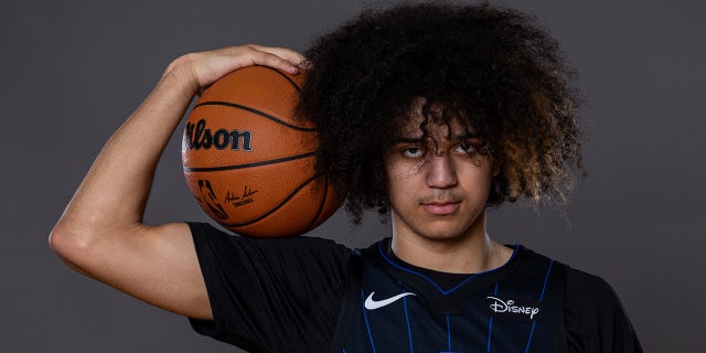 Anthony Black poses with basketball