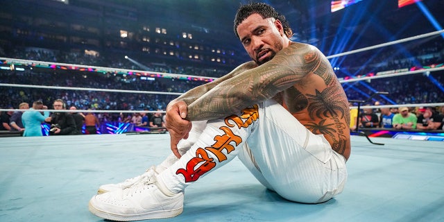 Jey Uso sits