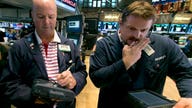 Dow plummets into correction territory