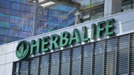 Herbalife 1Q earnings top estimates