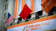 Alibaba begins trading in record-setting IPO