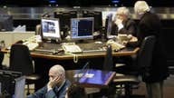 European shares mostly lower after weaker French, German data